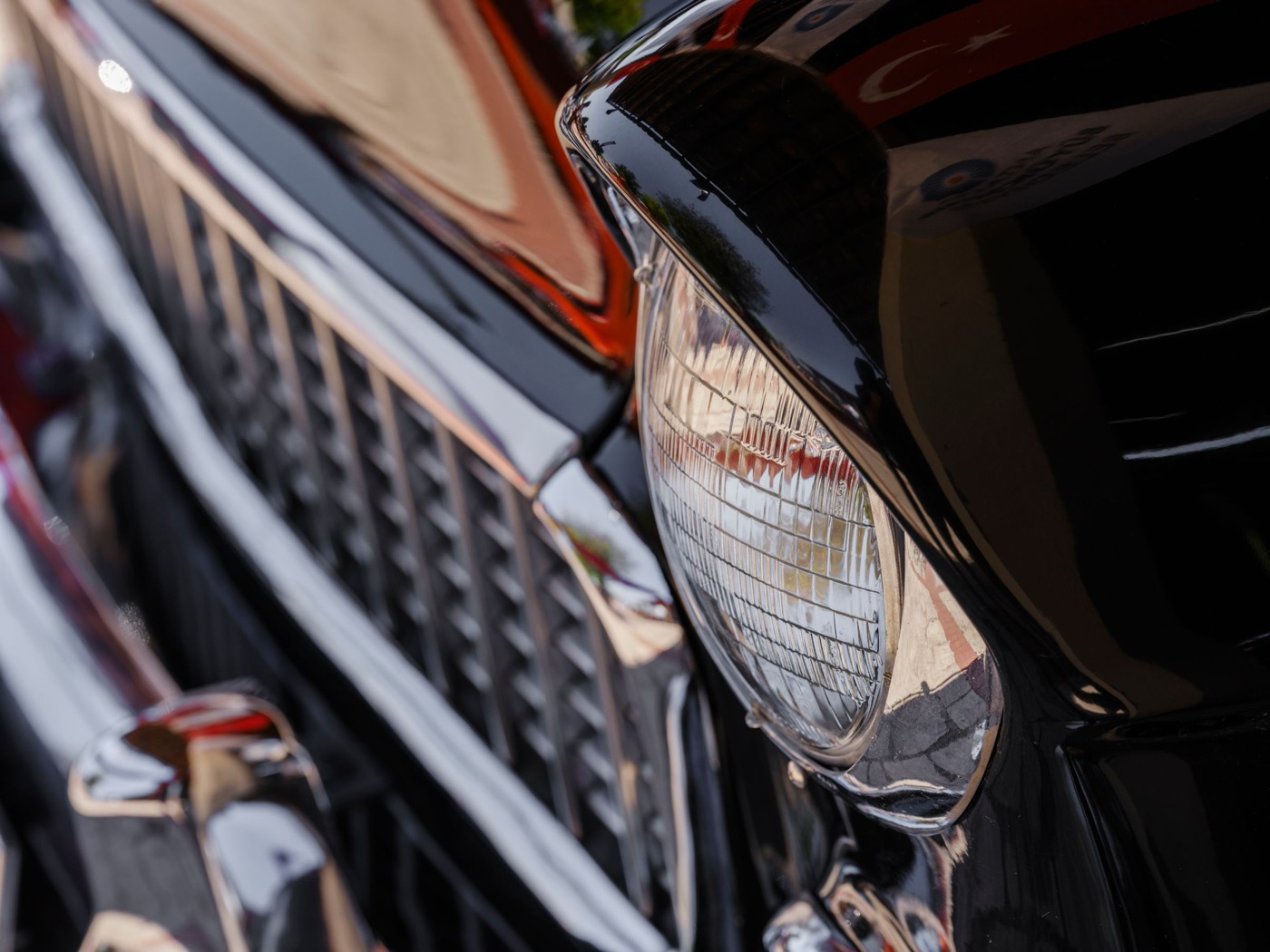 Detailed view of polished vehicle chrome and headlight trim